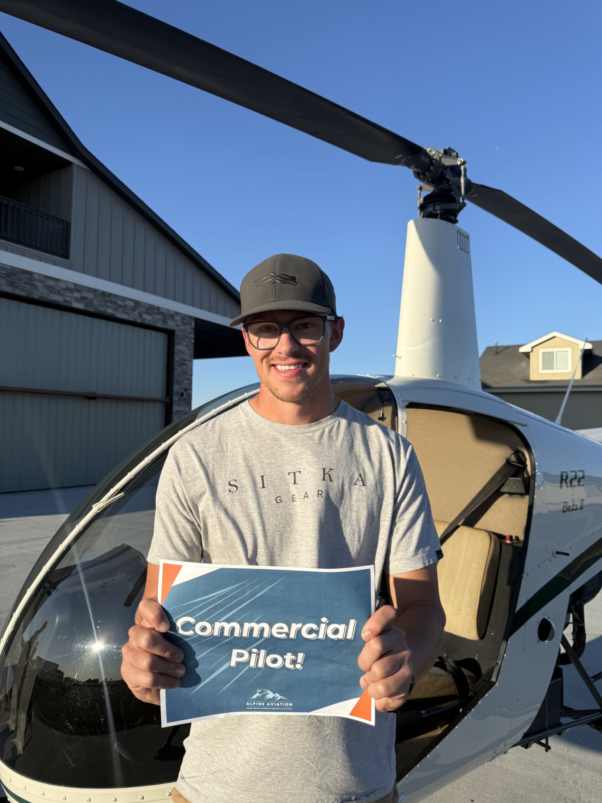 New commercial pilot holding the sign