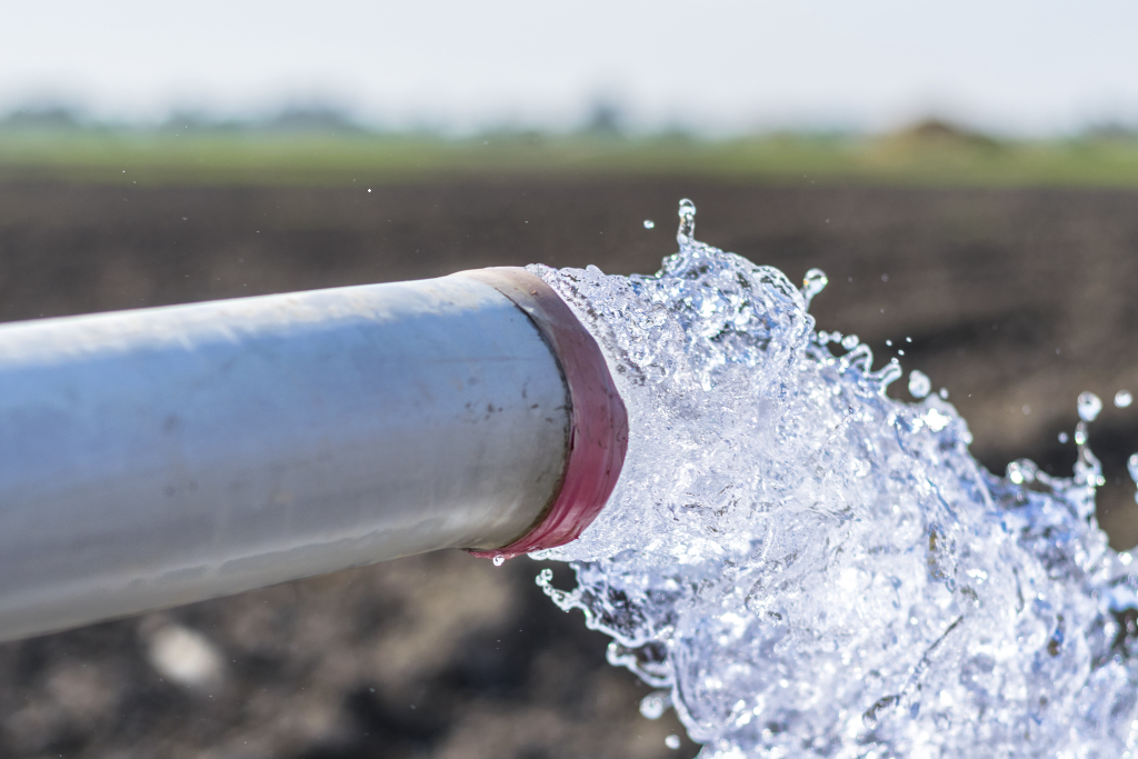 Fresh water flowing from a new well pipe